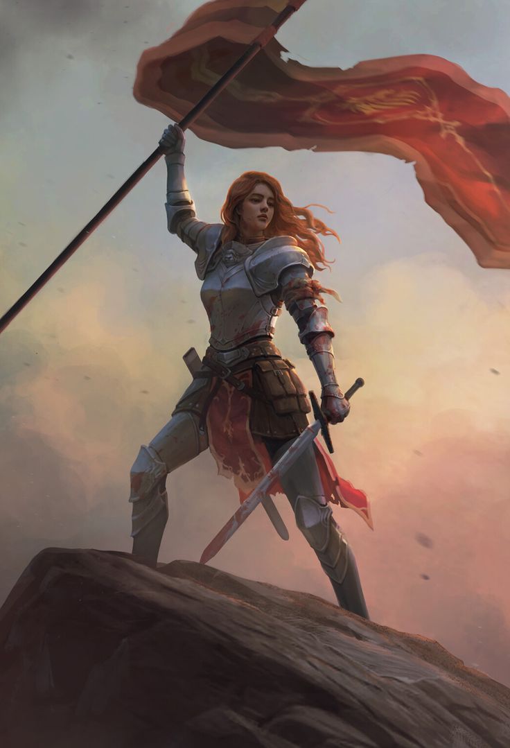 a woman holding a flag on top of a hill