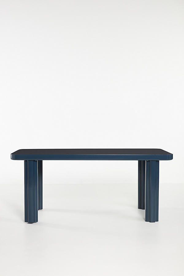 a blue bench sitting on top of a white floor