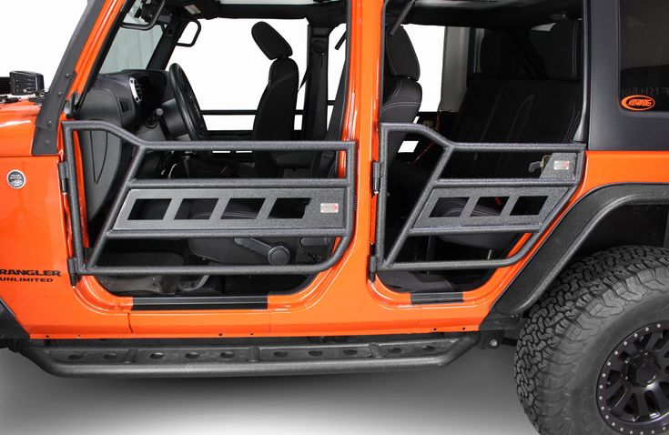 an orange jeep with its doors open