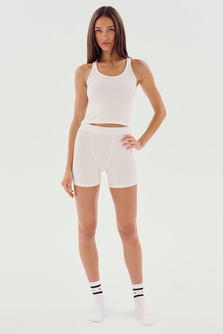 A cropped version of our fabulous Ashby tank. Super soft baby rib fabric hugs your body and layers effortlessly. BEST FOR: running, yoga, CrossFit, barre, Pilates, spin class, cycling and gym workouts. Sporty Crop Top With Built-in Shorts For Gym, Compression Crop Top For Yoga In Summer, Summer Compression Yoga Crop Top, Summer Yoga Compression Crop Top, White Seamless Tank Top With Minimal Stretch, White Compression Top For Pilates, Summer Cropped Activewear For Pilates, Cropped Summer Activewear For Pilates, Seamless Compression Tank Top For Yoga