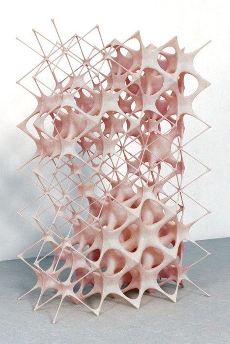 a sculpture made out of pink and white shapes