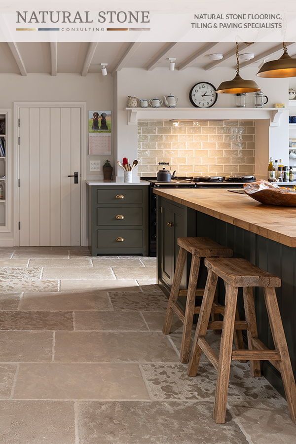 an image of a kitchen setting with natural stone flooring