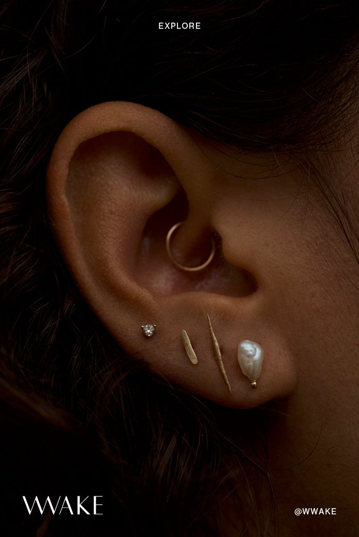 a close up of a person with ear piercings on their left and right ears