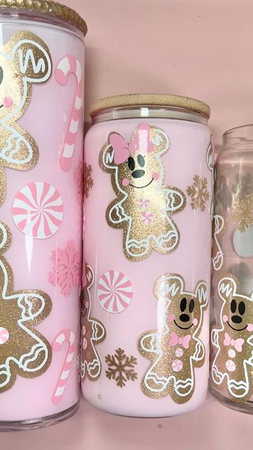 three pink and gold christmas jars with teddy bears on them