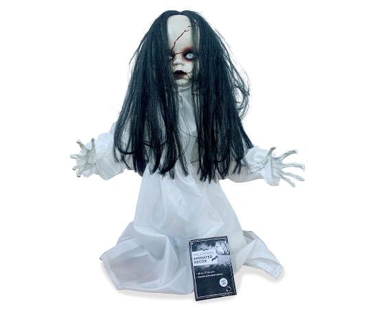 a creepy doll with long black hair and white makeup