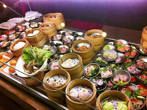 a table topped with lots of different types of sushi and other foods on top of it