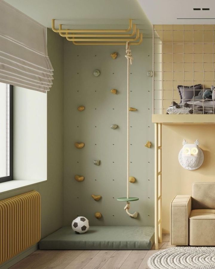 a living room with climbing walls and a couch in the corner, along with a soccer ball on the floor