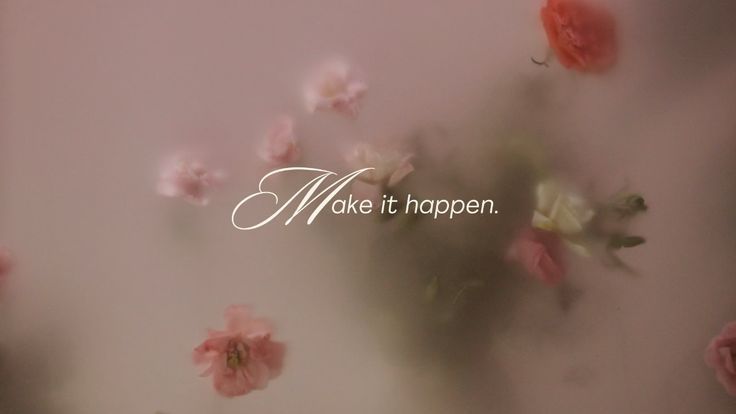 some pink flowers and the words make it happen