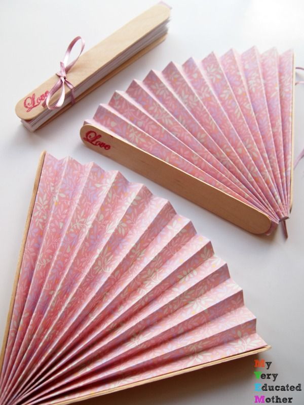 three pink fan shaped wooden matchesticks next to each other