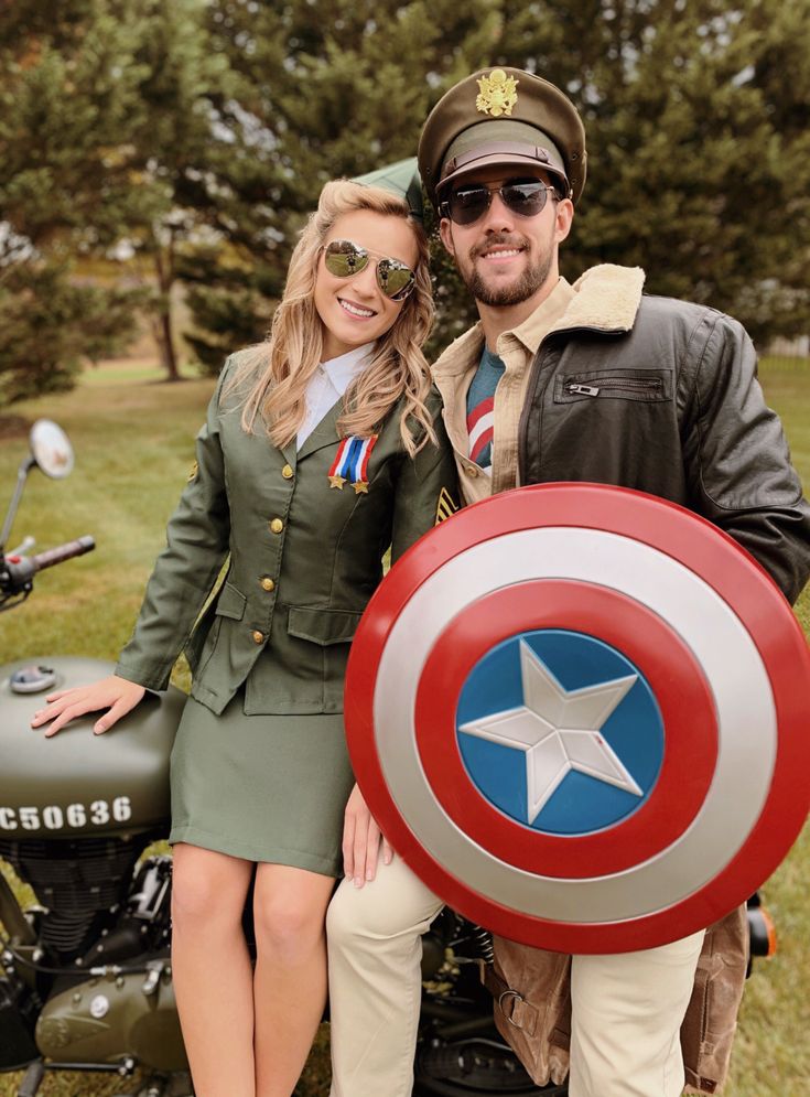 a man and woman dressed up as captain america posing for a photo on a motorcycle