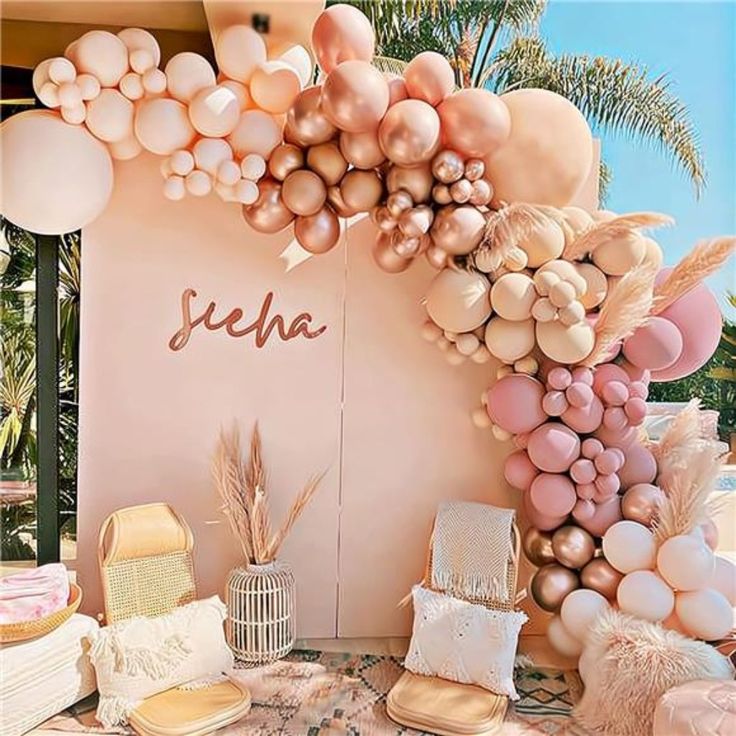 a table topped with lots of different types of food and balloons in the shape of animals