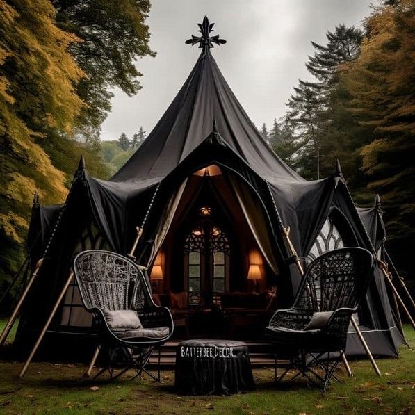 a black tent with two chairs in front of it