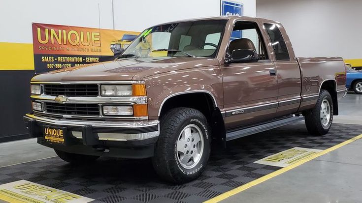 a brown truck is parked in a garage