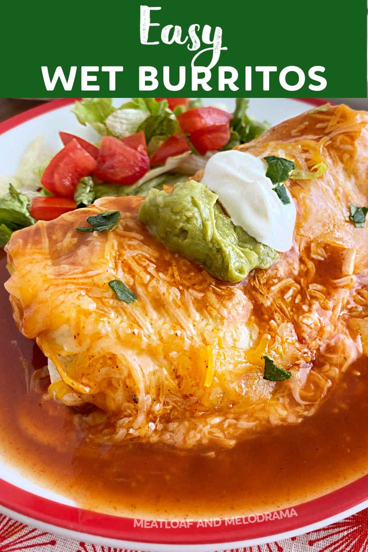 an enchilada on a plate with salsa and sour cream in the background