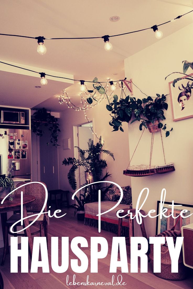 a living room filled with lots of plants next to a dining room table and chairs