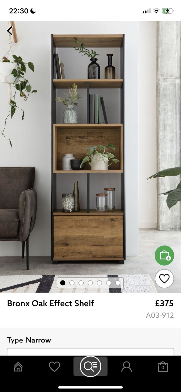 an open bookcase with plants and other items on it