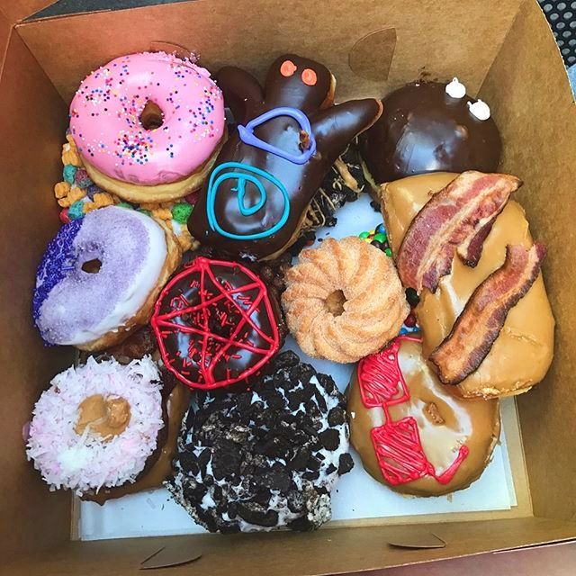 a box filled with lots of different types of donuts