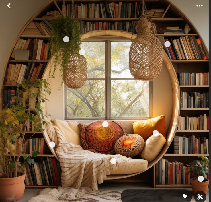 a living room filled with lots of furniture and bookshelves next to a window