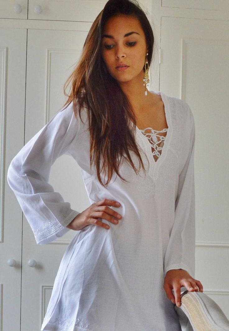 "'White Morrocan Tunic Dress - Karima's style-\" This is a vintage Moroccan Tunic dress ideal for any casual wear. Made in the traditional Moroccan tunic style, this tunic has some fabulous embroidery work. I hope you can enjoy them and be able to touch the moroccan art in your fashion. This tunic could be comfortably worn with any Jacket /Cardigan, and would look FAB with high heels,or leather boots. Could be worn with belts too Sizes: One Size (fits S-L size) Bust: 105 cm, Length: 35\" (87cm) Hippie Long Sleeve Vacation Dresses, Hippie White Dress For Beach Season, White Hippie Dress For Beach Season, Bohemian Summer Dresses For Honeymoon, Summer V-neck Tunic For Festivals, Long Sleeve Boho Dress For Beach, Loose Fit Long Sleeve Beach Dress For Beach Season, Free Size Long Sleeve Beach Dress For Summer, Embroidered Long Sleeve Cover-up For Vacation