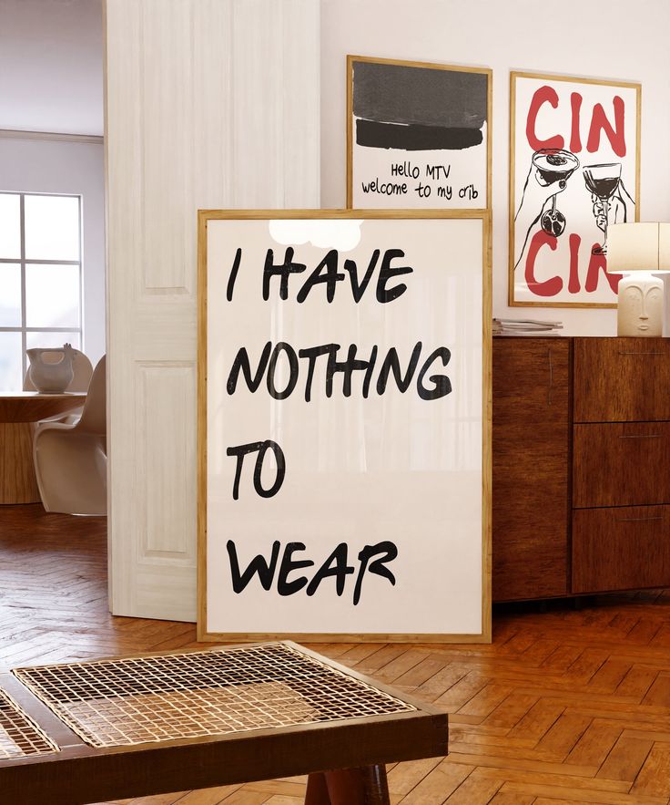 there is a sign that says i have nothing to wear on the wall in this room