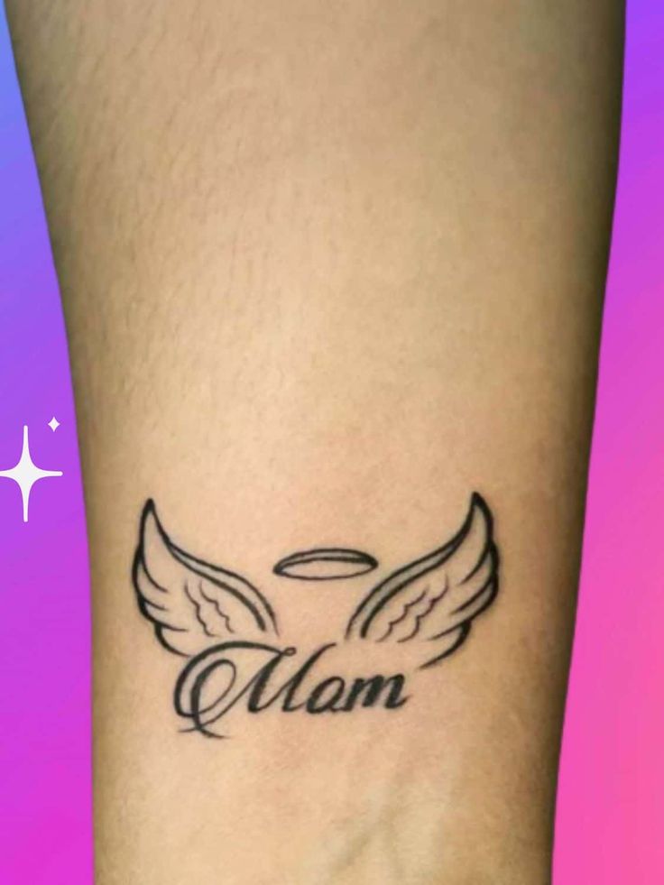 a woman's foot with an angel wing tattoo on the side of her leg