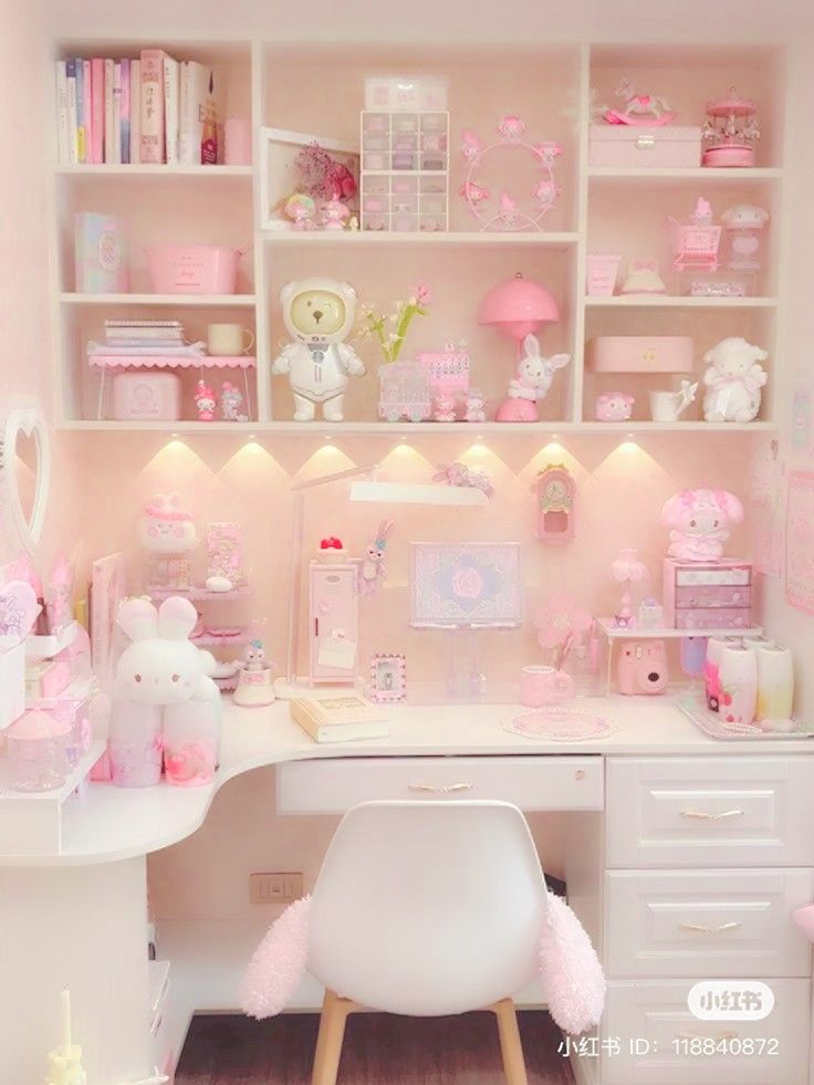 a room filled with lots of white furniture and pink accessories on top of the shelves