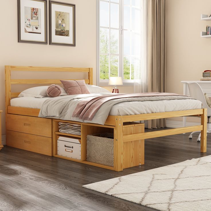 a bed with drawers underneath it in a room