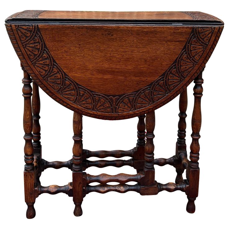 an old wooden table with carvings on the top and bottom edge, isolated against a white background