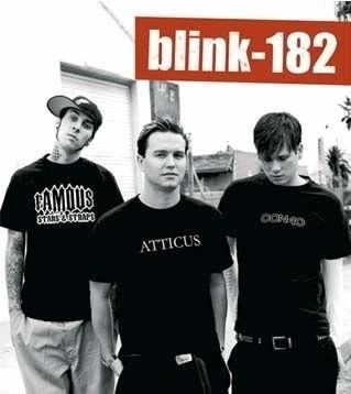 three men standing next to each other in front of a sign that says blink - 822