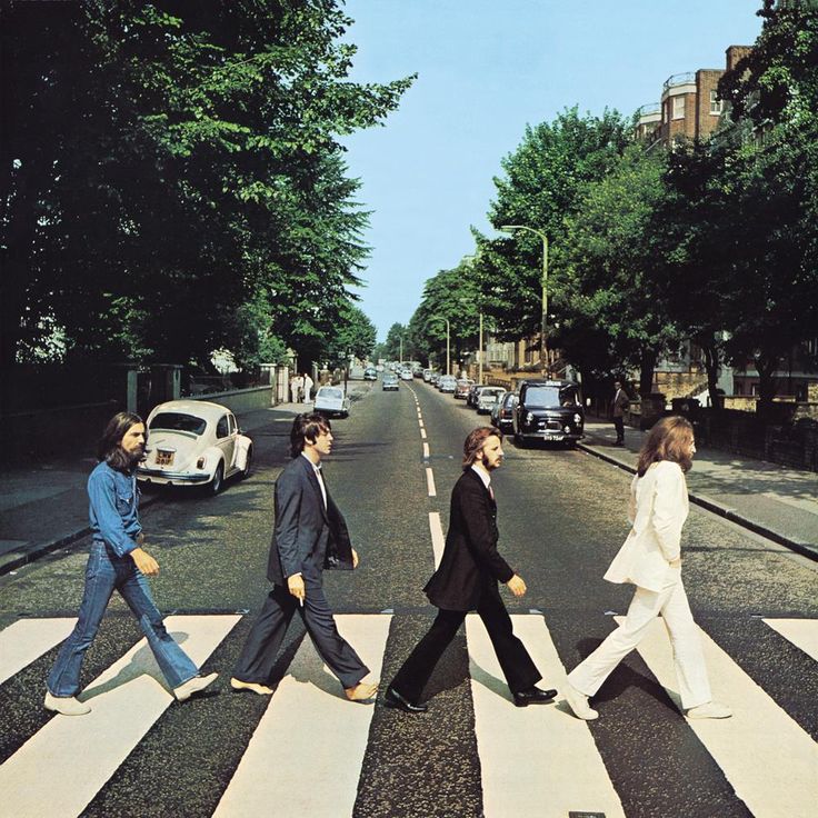 the beatles are walking across the street