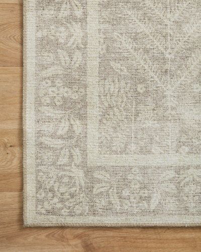 an area rug on a wooden floor