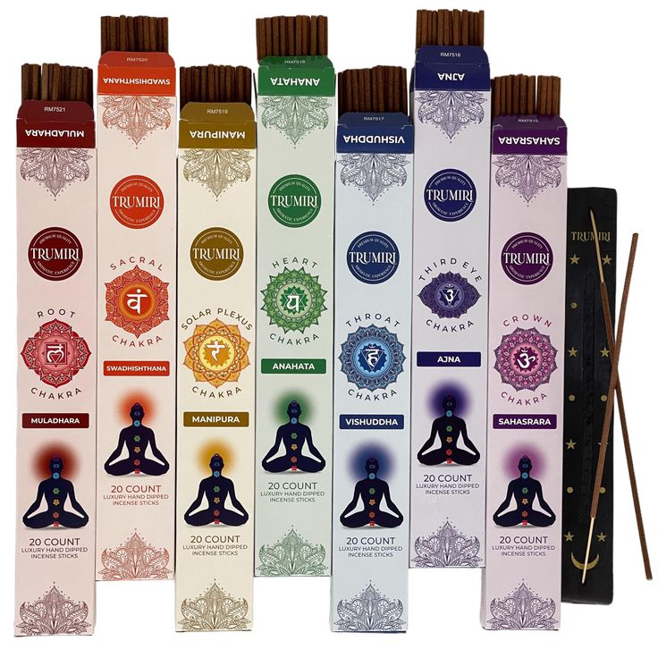 seven chakras are lined up in rows with incense sticks next to each other