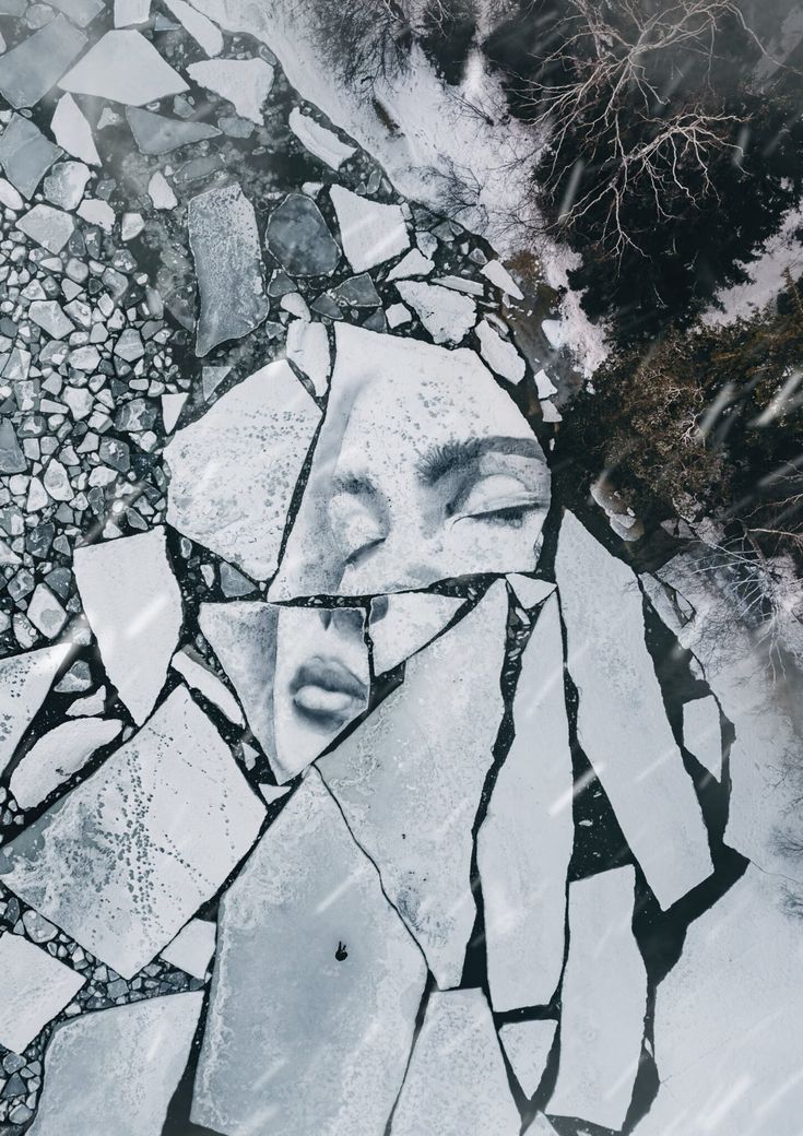 an image of a woman's face on ice