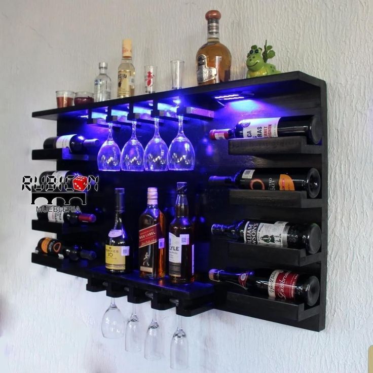 a wall mounted wine rack with bottles and glasses on it's sides, filled with liquor