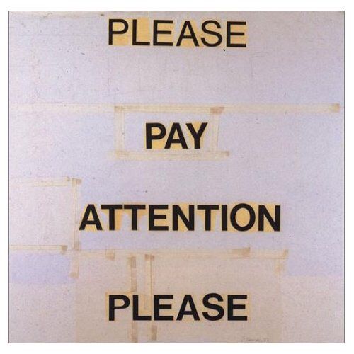 a sign that says please pay attention please