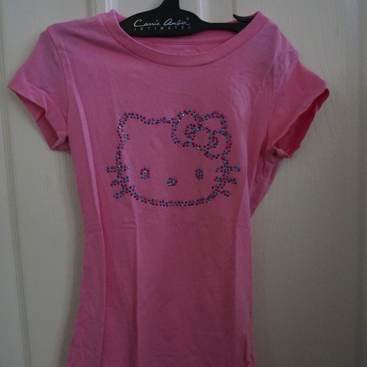 Pink Hello Kitty Tee With Gem Detail Size S. 100% Cotton. Armpit Tp Armpit 11 3/4 Inches. Top To Bottom 18 5/8 Inches. P-B4 Pink Leopard Print Shirt, Y2k Hello Kitty Clothes, Pink Hello Kitty Cotton Top, Hello Kitty Crew Neck Top, Fitted Hello Kitty Crew Neck Top, Pink Cotton Hello Kitty T-shirt, Hello Kitty Baby Tee, Fitted Cotton T-shirt With Hello Kitty, Fitted Hello Kitty Print Cute T-shirt