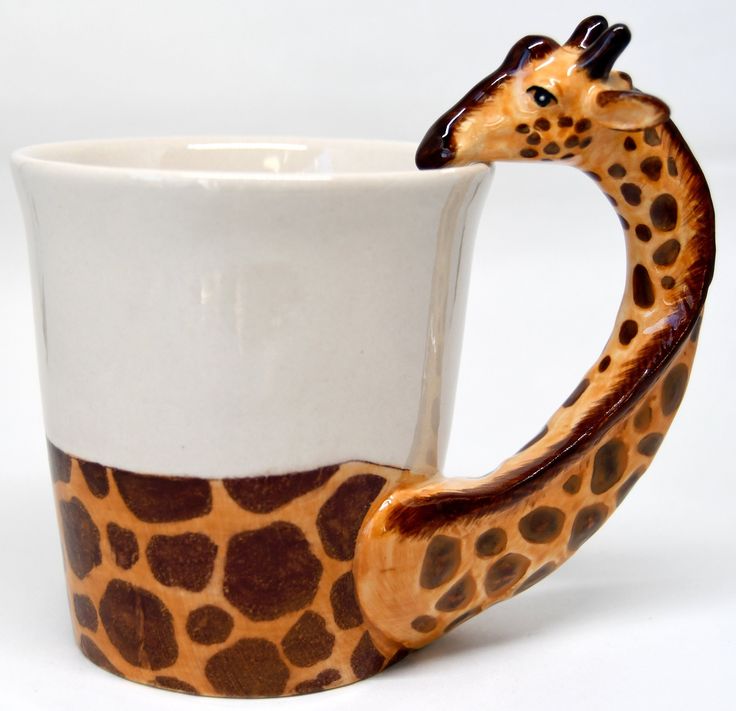 a giraffe shaped coffee cup with its tongue sticking out from it's side