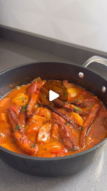 a pan filled with food sitting on top of a counter