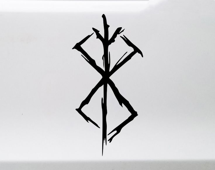 an artistic design on the side of a white car with black letters that read x