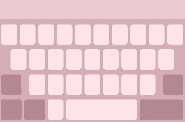 a computer keyboard is shown in pink and white