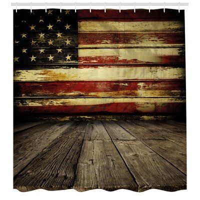 an old wooden floor with the american flag painted on it's wall behind it