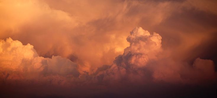 an airplane flying in the sky during a storm