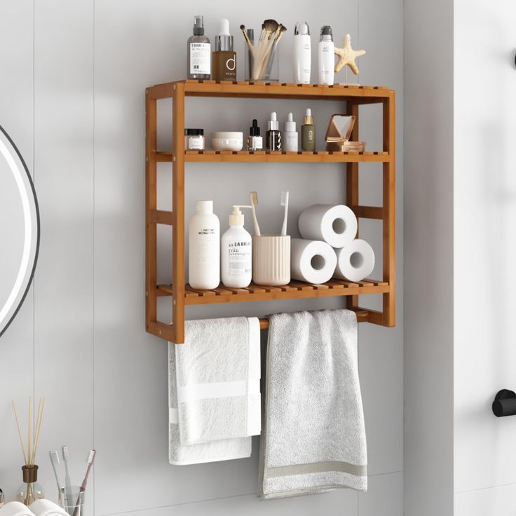 a wooden shelf with towels, soaps and other items on it