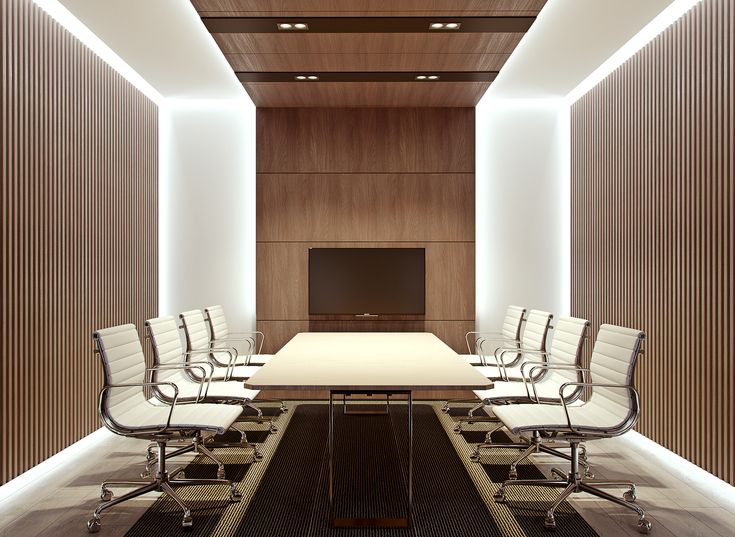 an empty conference room with white chairs and a long table in front of a flat screen tv