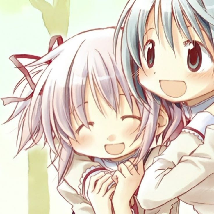 two anime characters are hugging each other