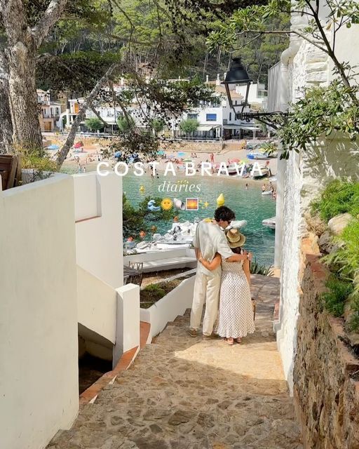 a man and woman are walking down the stairs to their boat dock in costa brava