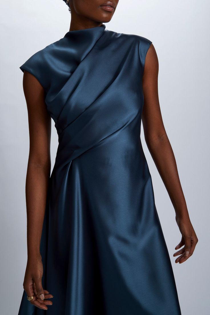 Fluid Satin relaxed drape dress with asymmetric handkerchief hem. Shown in Petrol. It is possible to have this style Made to Order in any of our standard Fluid Satin colors, please reach out to customerservice@amsale.com to place an order. Designer Couture Gowns, Formal Draped Dress, Front Drape Dress, Chanderi Dress Designs, Edgy Formal Dresses, Fitted Silk Asymmetrical Dress, Pre-draped Evening Dress With Asymmetrical Hem, Chic Asymmetrical Dress With Pleated Bodice, Elegant Asymmetrical Dress With Pleated Bodice