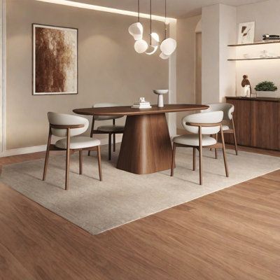 a modern dining room with wood floors and white chairs