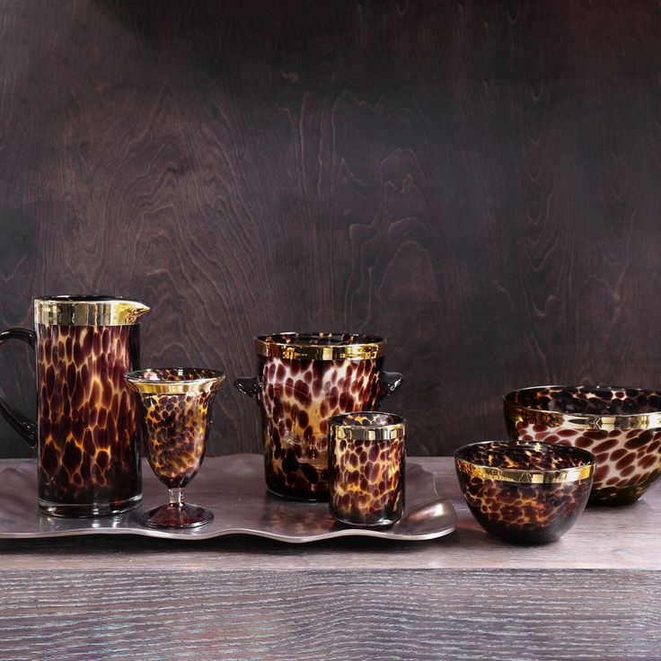 a table topped with different types of cups and saucers