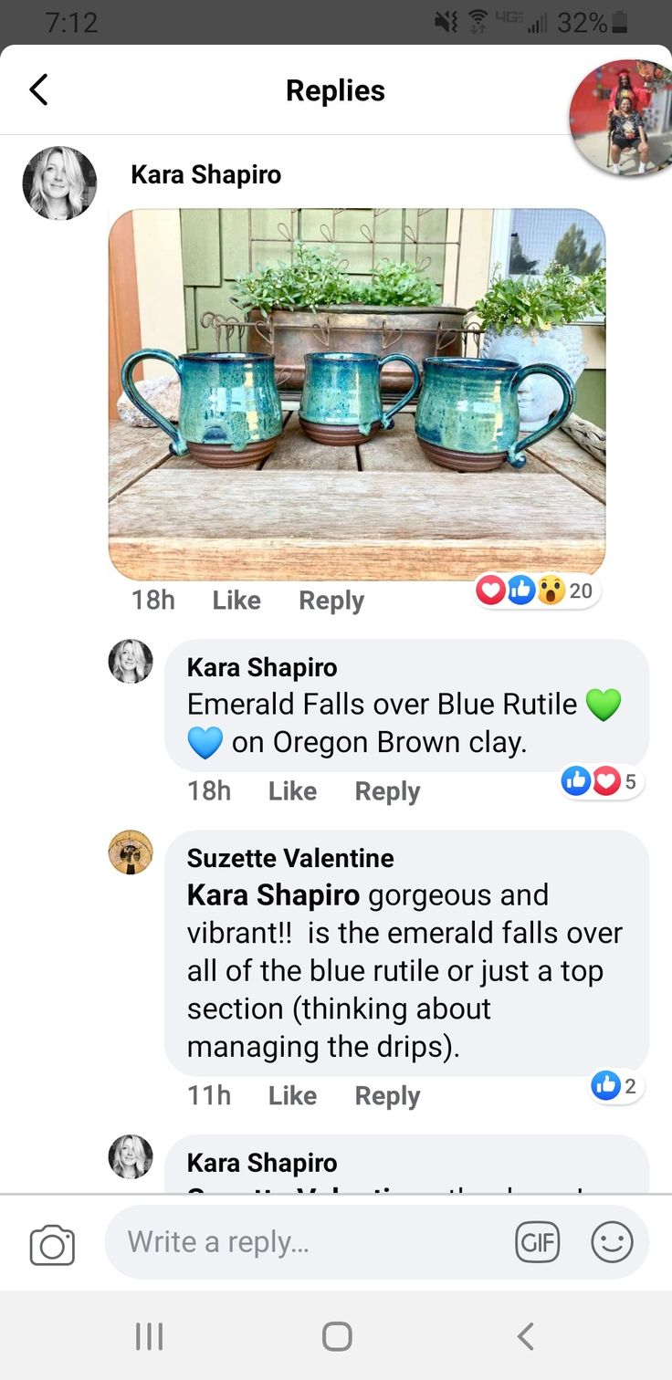 two blue teapots sitting next to each other on top of a wooden table